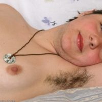 European amateur displaying hairy underarms before releasing hairy cunt from panties