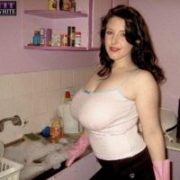 Brunette MILF Angela White modeling non nude in skirt and in bathroom and kitchen