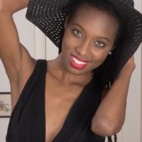 Thin ebony amateur Saf spreads her natural pussy while wearing a sun hat and heels