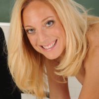 Experienced yellow-haired MILF doffing business clothes and lingerie to model nude