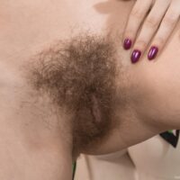 Brunette Euro chick Gerda May revealing her unshaven vagina and puny boobies in pigtails