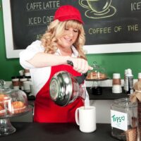60 plus blonde Dawn Jilling exposes her breasts while serving coffee inside a diner