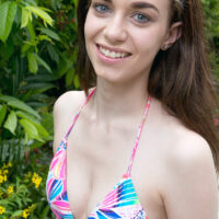 Sweet teen Tali Dova looses her tiny tits from a bikini before getting in a pool