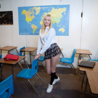 Blonde schoolgirl Skylar frees her small tits before giving a blowjob in a classroom