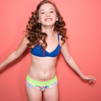 Petite teen with curly red hair Marissa Mae bares her flat chest while wearing panties