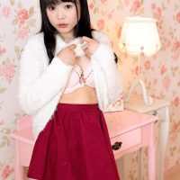 Cute Asian teen Yui Kawagoe does away with a skirt and lingerie to pose in the nude