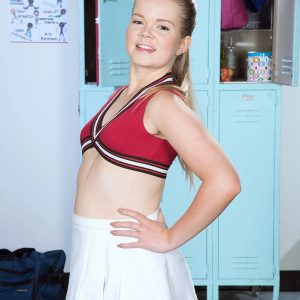 Young cheerleader Lexy displays her flexibility while going topless in cotton panties