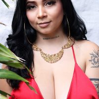 Latina solo girl Kim Velez unveils her big natural tits while undressing