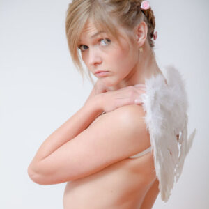 Angelic blonde teen Fulvia poses nude in socks while sporting a set of angel wings