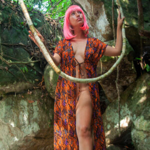 Solo girl Red Eva sports pink hair while showing her great body in an outdoor location