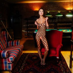 Hot brunette Sonya Blaze shoots pool before taking off a bodystocking to go naked