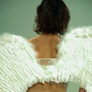 Gorgeous teen Elissa dons a set of angel wings during a solo modelling engagement