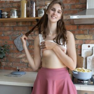 Nice teen Milly gets bare naked during solo action after making popcorn in a kitchen